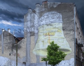 Graffiti of a megaphone on a house wall, Krakow, Poland