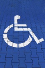 Parking space marked in blue for disabled people, Krakow, Poland