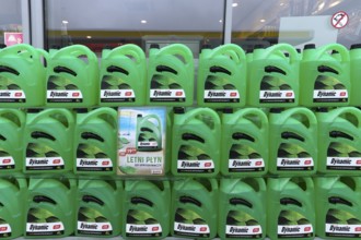 Canister with cleaning water at a gas station, Krakow, Poland