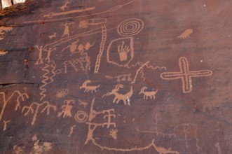 Ancient petroglyphs and symbols engraved in rock walls testify to historic art in the desert,