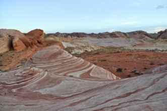 Rock formations with distinctive red and white stripes under a blue sky, Valley of Fire State Park,