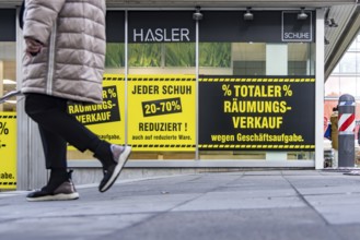 Clearance sale in the city center. A shoe store offers discounts on sales. Stuttgart,
