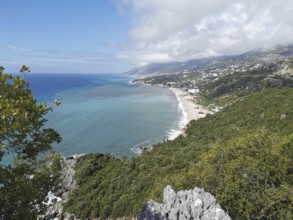 Extensive view of a coastal town surrounded by forests and mountains, Dhermi, Albanian Riviera,