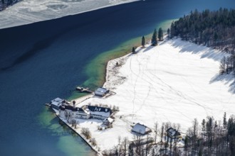 View from above of the snow-covered pilgrimage church of St. Bartholomä am Königssee, Berchtesgaden