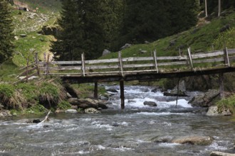 Torrent and old wooden bridge on the Transfogarasan High Road, Transfagarasan, connects the Arges