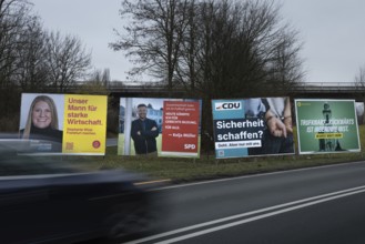 Large election posters are standing on a street in the northwest of Frankfurt. The Hessian state