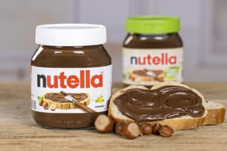 Nutella and Nutella Plant Based vegan nut nougat cream jar on bread with logo in Stuttgart, Germany