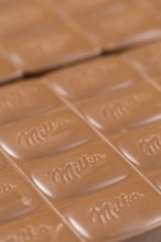 Milka chocolate bar alpine milk chocolate background with logo in Stuttgart, Germany