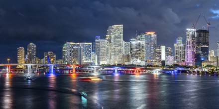 Miami skyline with high-rise real estate in downtown panoramic ocean view at night in Miami, USA