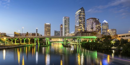 Tampa skyline with skyscrapers and bridge over Hillsborough River panorama at night in downtown