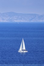 Sailing boat in the Mediterranean Aegean Sea vacation off the island of Rhodes, Greece