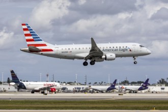 An American Eagle Envoy Air Embraer 175 aircraft with license plate N323ED at Miami airport, USA