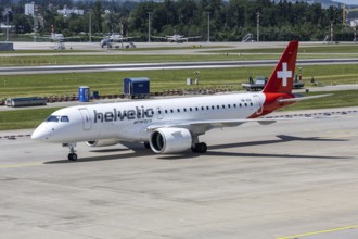 An Embraer 190 E2 Helvetic Airways aircraft with the HB-AZA license plate at Zurich Airport,