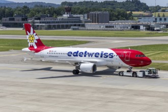 An Edelweiss Airbus A320 aircraft with the HB-JJK license plate at Zurich Airport, Switzerland