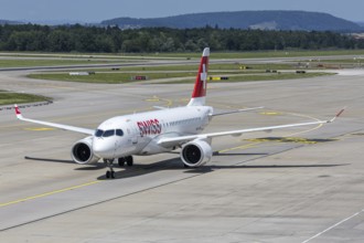 A Swiss Airbus A220-100 aircraft with the HB-JBH license plate at Zurich Airport, Switzerland