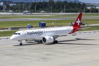 An Embraer 190 E2 Helvetic Airways aircraft with the HB-AZG license plate at Zurich Airport,