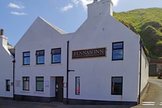 White inn in front of green hills under blue sky, hotel, film location, Local Hero, Pennan,