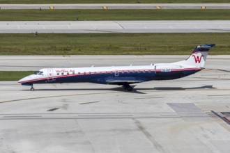 A Western Air Embraer 145 aircraft with the license plate C6-VIP at Fort Lauderdale airport, USA