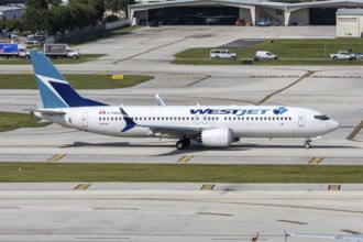 A WestJet Boeing 737 MAX 8 aircraft with the license plate C-FNAX at Fort Lauderdale Airport, USA