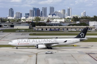 An Air Canada Airbus A330-300 aircraft with the license plate C-GHLM and Star Alliance special
