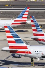 Boeing and Airbus aircraft tail units of American Airlines with the license plate N737US at Phoenix