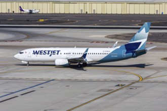 A Westjet Airlines Boeing 737-800 aircraft with the license plate C-FRWA at Phoenix airport, USA