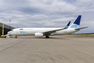 An ASL Airlines Boeing 737-800BCF aircraft with the license plate OE-IWB at the airport in