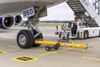 Tow bar on an Atlas Air Boeing 747-8F aircraft with the license plate N860GT at the airport in