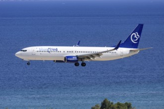A Bluebird Airways Boeing 737-800 aircraft with the license plate 9H-KAR at Rhodes airport, Greece