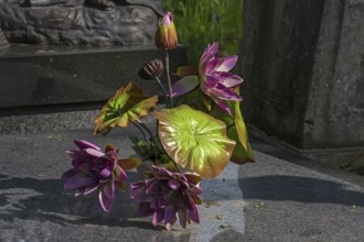 Artificial flower decoration on a grave, Lützenhofer cemetery Lychakivsky cemetery, Lviv, Galicia,