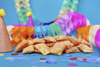 German pastries called 'Mutzen pastries or Muzenblätter' with powdered sugar on festive background.