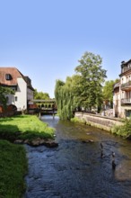 Ettlingen, Germany - August 13th 2025: Alb brook in historic center of Ettlingen, Germany. Small
