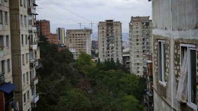Old high-rise buildings with views of the city and surrounding trees, nostalgic curtain blowing