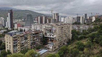 Panoramic view of a residential area with construction cranes and high-rise buildings, Tbilisi,