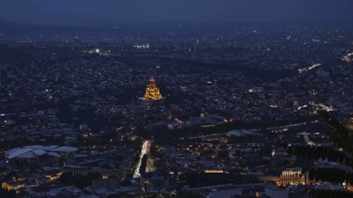 Nocturnal view of Tbilisi with illuminated buildings and roads, Tbilisi, Georgia