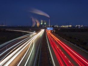 Night shot, long exposure, light trails on the A38 motorway, Schkopau power plant in the back,