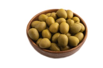 Fresh green olives in wooden bowl isolated on white background. side view, close up