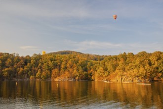 Hot air balloons over the Brno Reservoir (Brnenská prehrada) on the Svratka River on a sunny autumn
