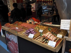 Lively market stand with various meats, including Wagyu, and other foods, Tsukiji Outer Market,