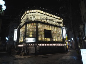 Traditional restaurant at night with glowing lanterns and signs, Japanese atmosphere, Nagano, Japan