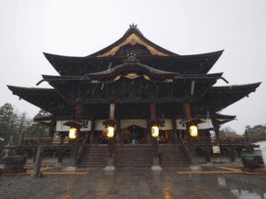 Japanese temple in rain giving off a calm atmosphere, Zenko-ji Temple, Nagano, Japan