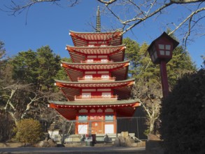 Five-story pagoda in traditional Japanese style surrounded by trees, Chureito Pagoda, Kawaguchiko,