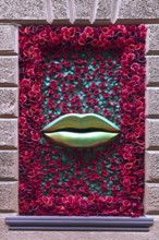 Window with rose petals and gold-colored mouth, Casanova restaurant, Lviv, Ukraine