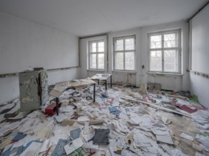 A room full of files lying around in an abandoned administration building, Lost Place,