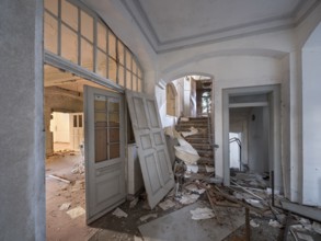 Staircase of an abandoned administration building full of rubble and trash, Lost Place,