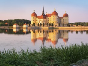 Moritzburg Castle, Augusts the Strong hunting lodge in the evening light, water reflection in the