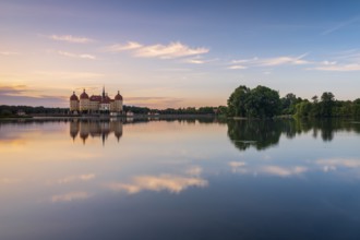 Moritzburg Castle, Augusts the Strong hunting lodge at dawn, water reflection in the lake, Saxony,