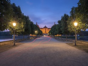 Avenue with lanterns as access to Moritzburg Castle, Augustus the Strong hunting lodge at dusk,