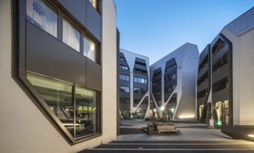 The Sonnenhof at dusk, office and residential building, modern architecture, Jena, Thuringia,