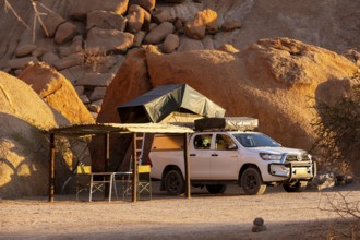 Camping vehicle with tent on rocky Spitzkoppe, Spitzkoppe, Namibia